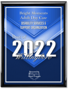 A plaque awarded to Bright Moments Adult Day Care Center in Burlington County, NJ for "Best of 2022" in the category of Disability Services & Support Organization by the Willingboro Award Program. The plaque features a blue background with silver and white text.